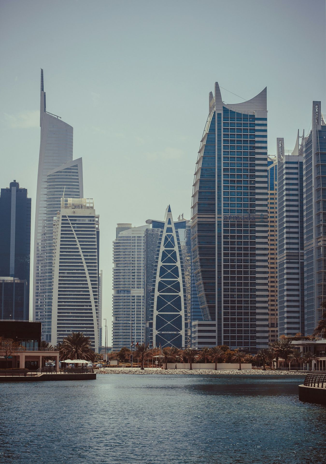 a large body of water in front of tall buildings